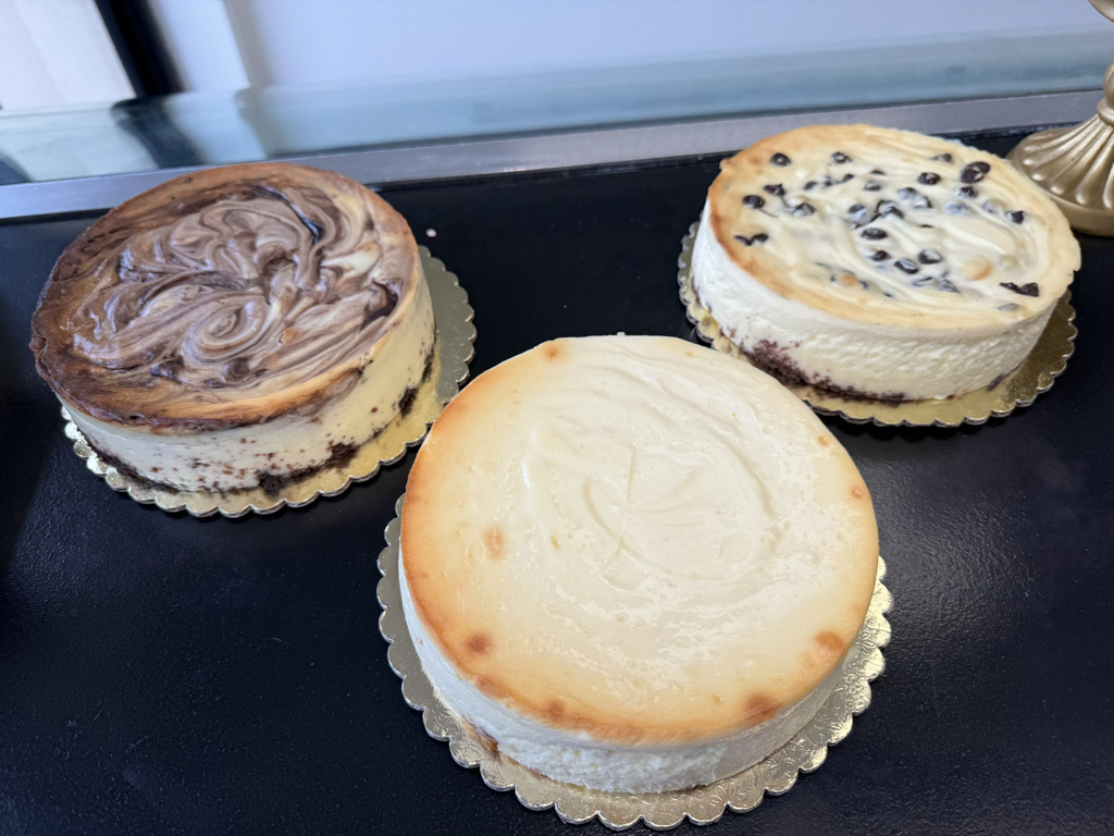 A picture of three assorted cheesecakes